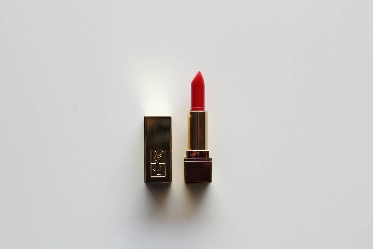 Close-up of a lip liner with sharpener lid being used to define lips precisely