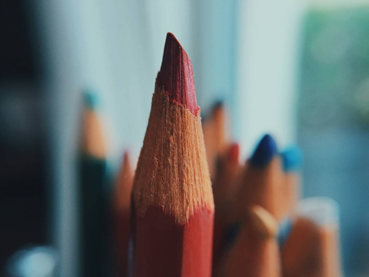 Side-by-side comparison showing broken lip liner from standard sharpener vs. clean point from cosmetic-specific sharpener